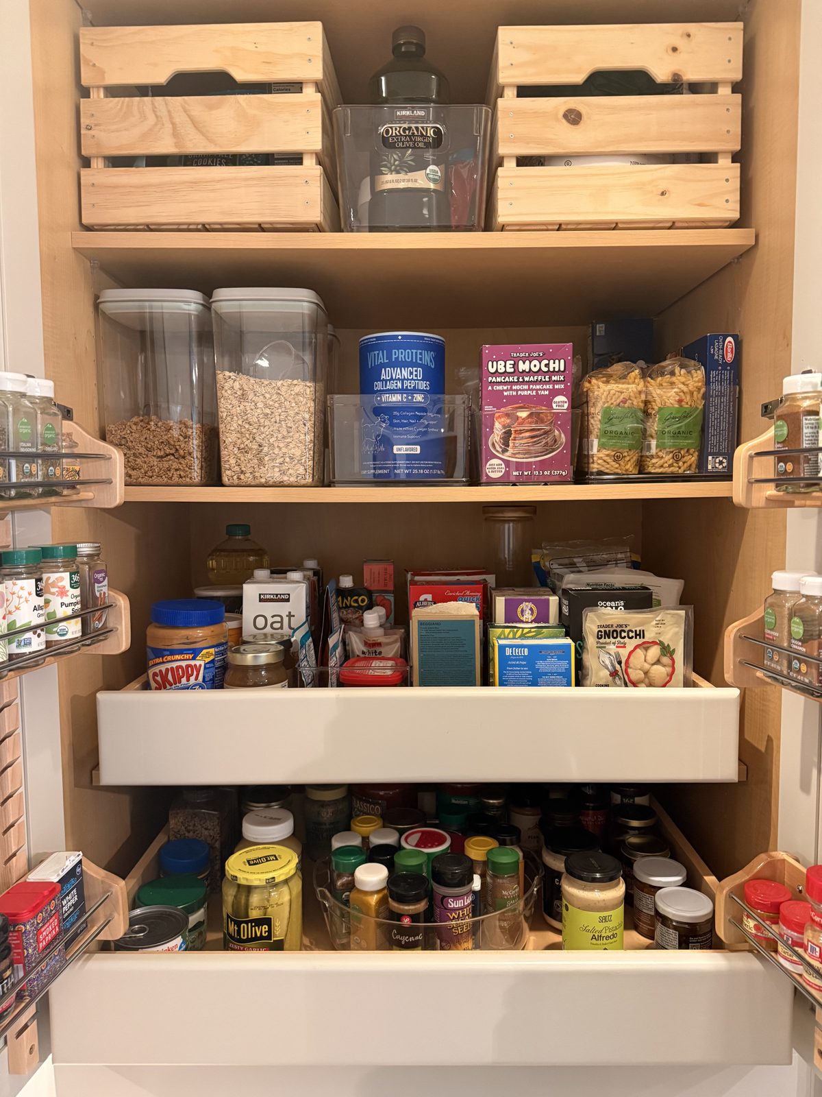 Organized pantry with labeled containers and pull-out shelves